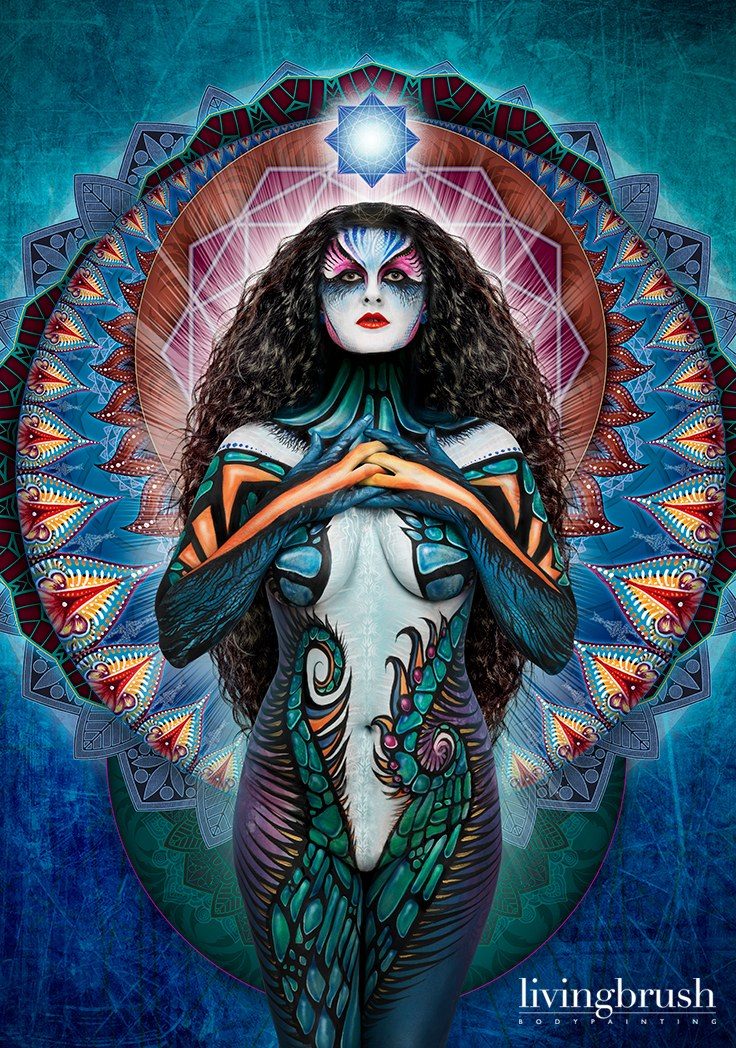 Bodypainting in teal and white, finished with a mandala halo